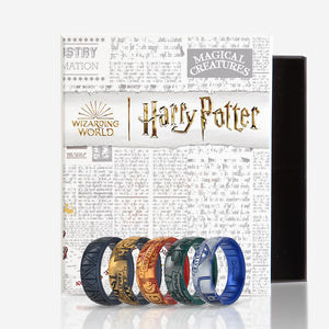 Image of Harry Potter Collection Bundle - 5 ring set in a Harry Potter branded box. Gryffindor, Metallic warm golden yellow and deep, true red with hints of shimmer. Ravenclaw, Metallic warm golden yellow and deep, true red with hints of shimmer. Hufflepuff, Metallic warm golden yellow and metallic true black. Slytherin,  Metallic dark Gray with hints of silver and iridescent deep forest green. Deathly Hallows, Metallic true black..